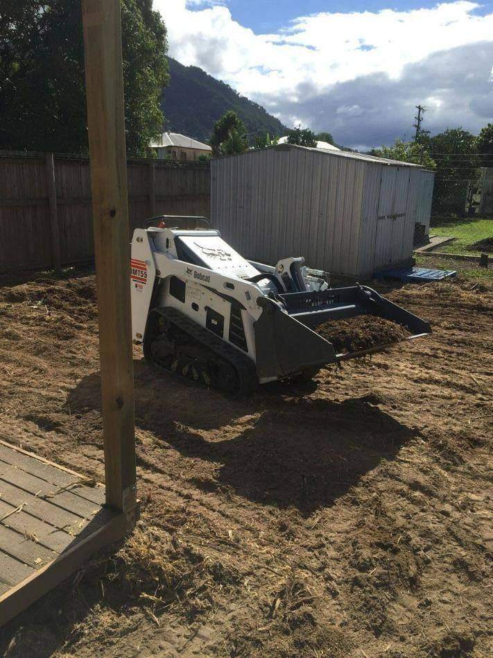 Small excavator in a backyard