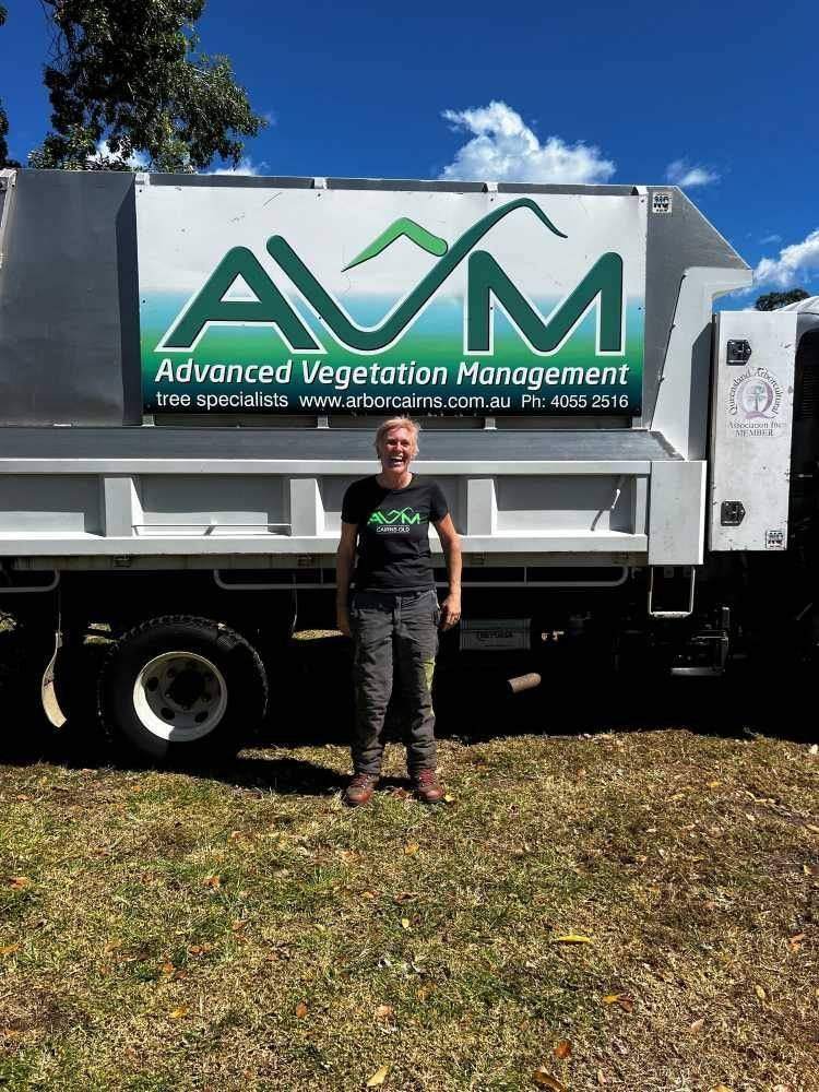 Arborist standing beside an AVM truck